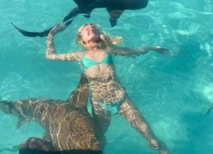 Charlotte Lawrence swims with sharks in The Maldives (Image: Instagram)