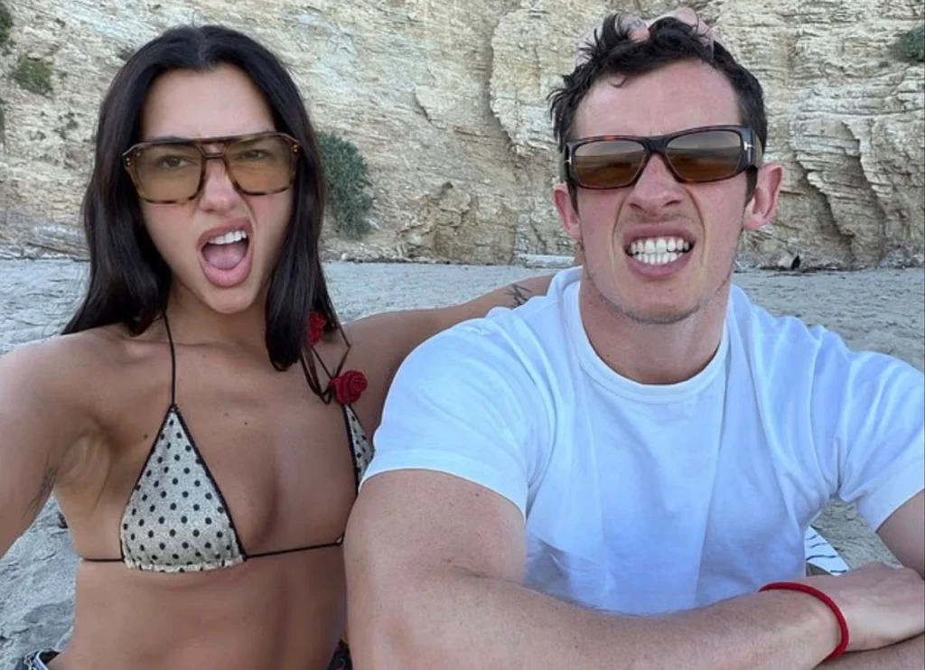 Dua Lipa & Callum Turner Share A Romantic Beach Date