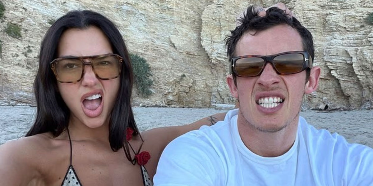 Dua Lipa & Callum Turner Share A Romantic Beach Date