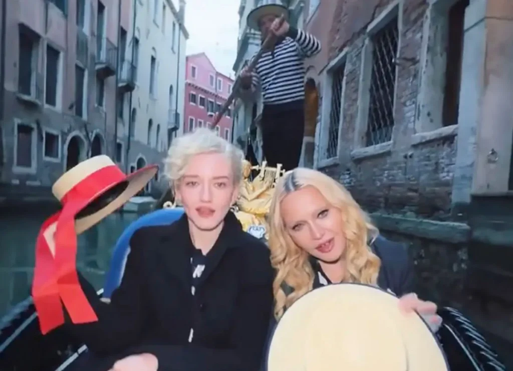 Madonna & Julia Garner Wear Matching Outfits As They Ride Gondola Through Venice